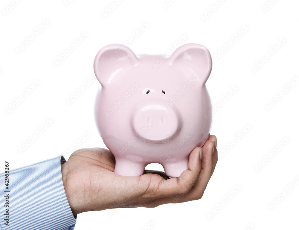 Young adult holding piggy bank isolated on whie background