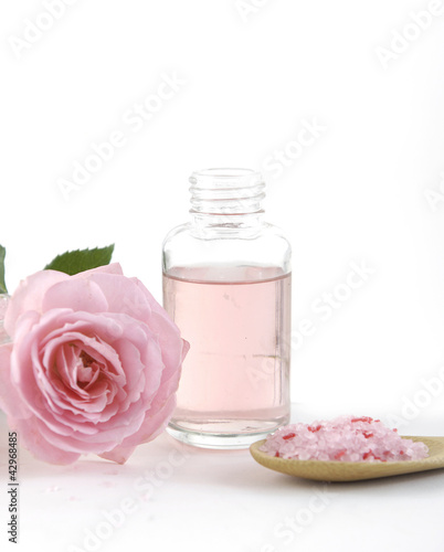 Rose flowers and massage lotion, Spoon of spa salt