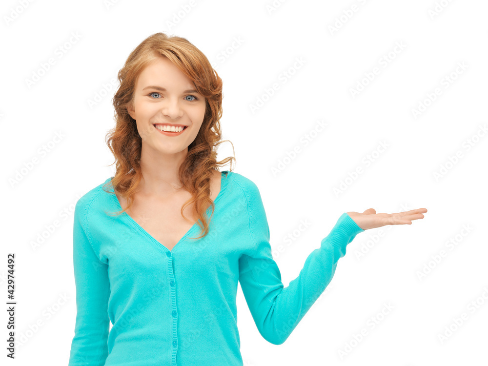 girl showing something on the palm of her hand