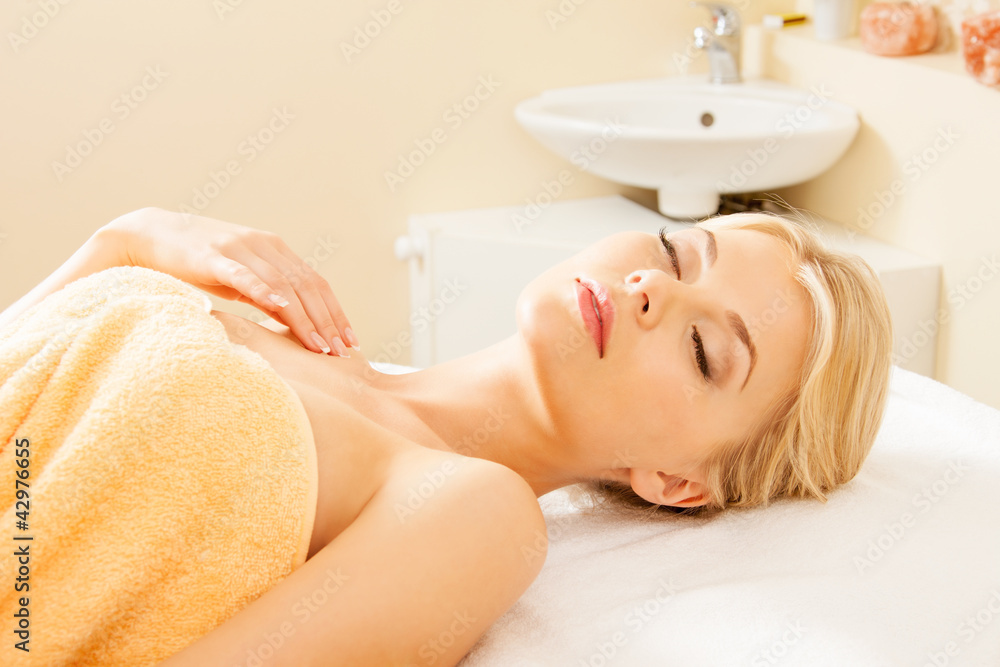 Naklejka premium beautiful woman in spa salon