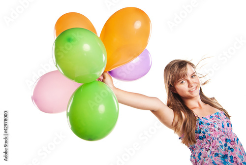 Teenage girl playing with balloons