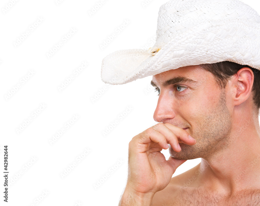 Profile portrait of young man in beach hat looking on copy space Profile portrait of young man in beach hat looking on copy space