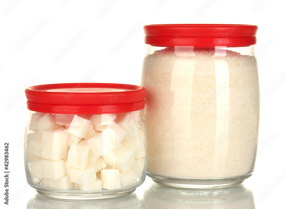 Jars with white lump sugar and white crystal sugar isolated Jars with white lump sugar and white crystal sugar isolated