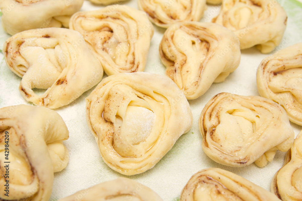 Half-finished product of a roll with cinnamon Half-finished product of a roll with cinnamon