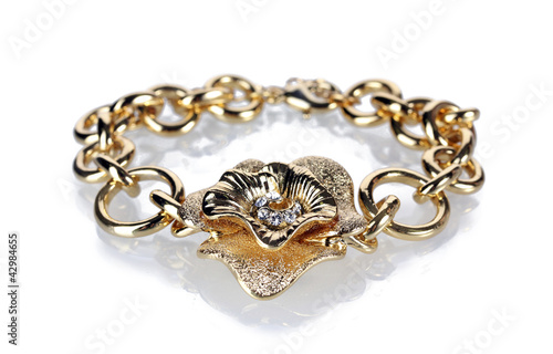 Beautiful golden bracelet with precious stones isolated on