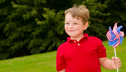 Child celebrating Independence Day on July Fourth