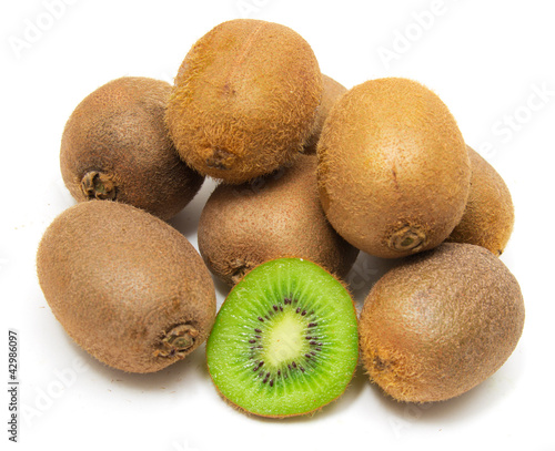 sliced and whole kiwi isolated on white background