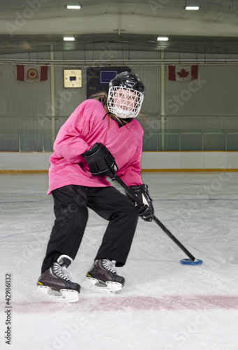 Ringette Skater in Action at Rink