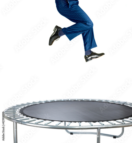 Tela businessman bouncing on a trampoline on white