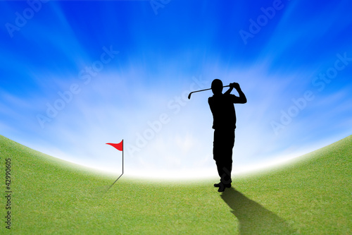 Silhouette of Golfer on green and blue sky