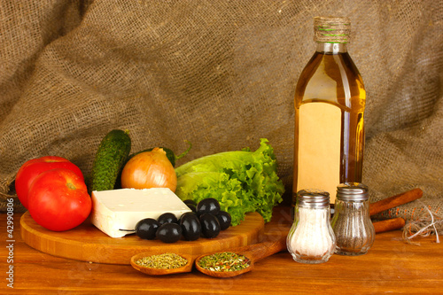 Fototapeta Naklejka Na Ścianę i Meble -  Ingredients for a Greek salad on canvas background close-up
