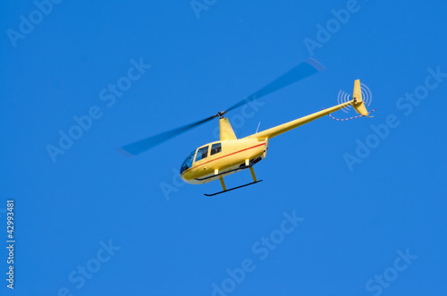 Yellow Robinson R-44 "Raven" helicopter