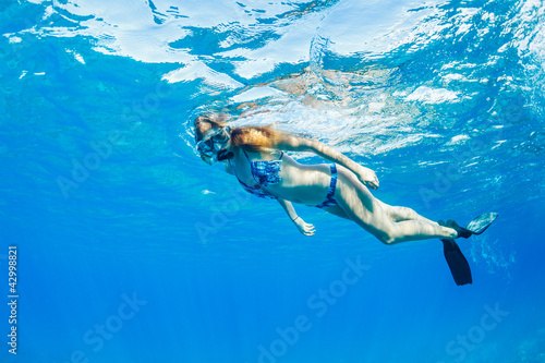 Woman Snorkeling in Tropical Ocean © EpicStockMedia