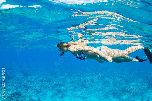 Woman Snorkeling in Tropical Ocean