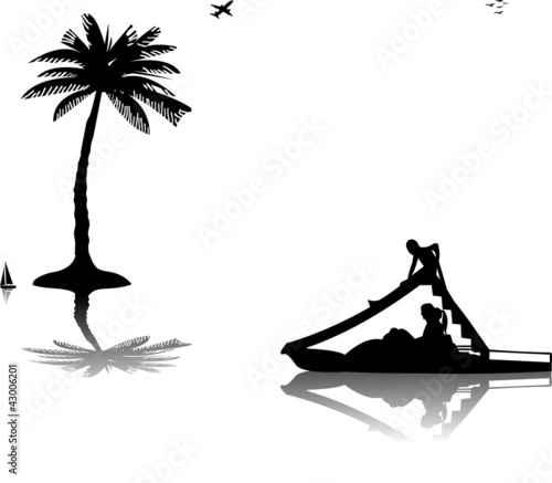 Family on pedal boat  in sea near the palm trees silhouette