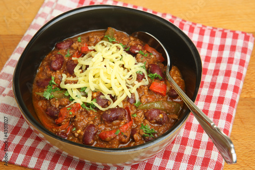 Bowl of Hot Beef Chili with Cheese photo