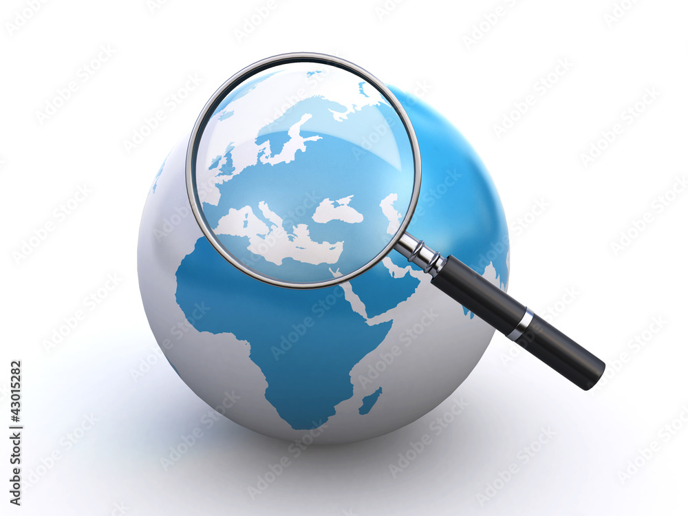 world globe and a magnifying glass world globe and a magnifying glass