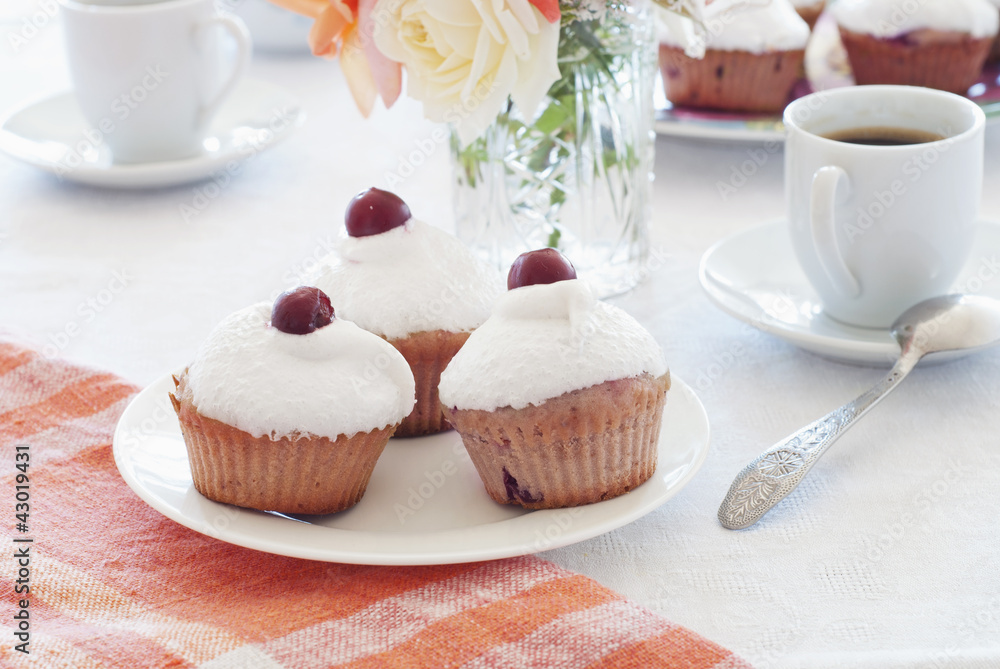 Breakfast: cherry muffins with coffee Breakfast: cherry muffins with coffee