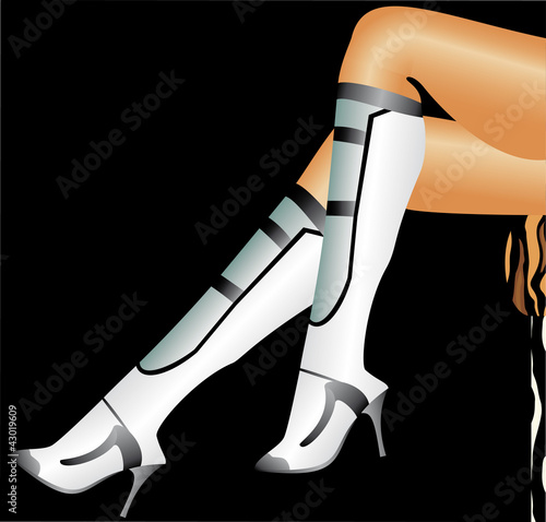Elegant perfect female legs in leather boots on a heel