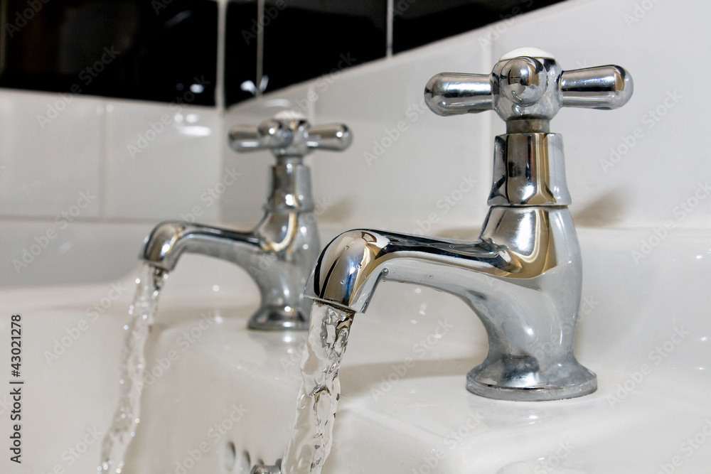 Chrome faucets with running water Chrome faucets with running water