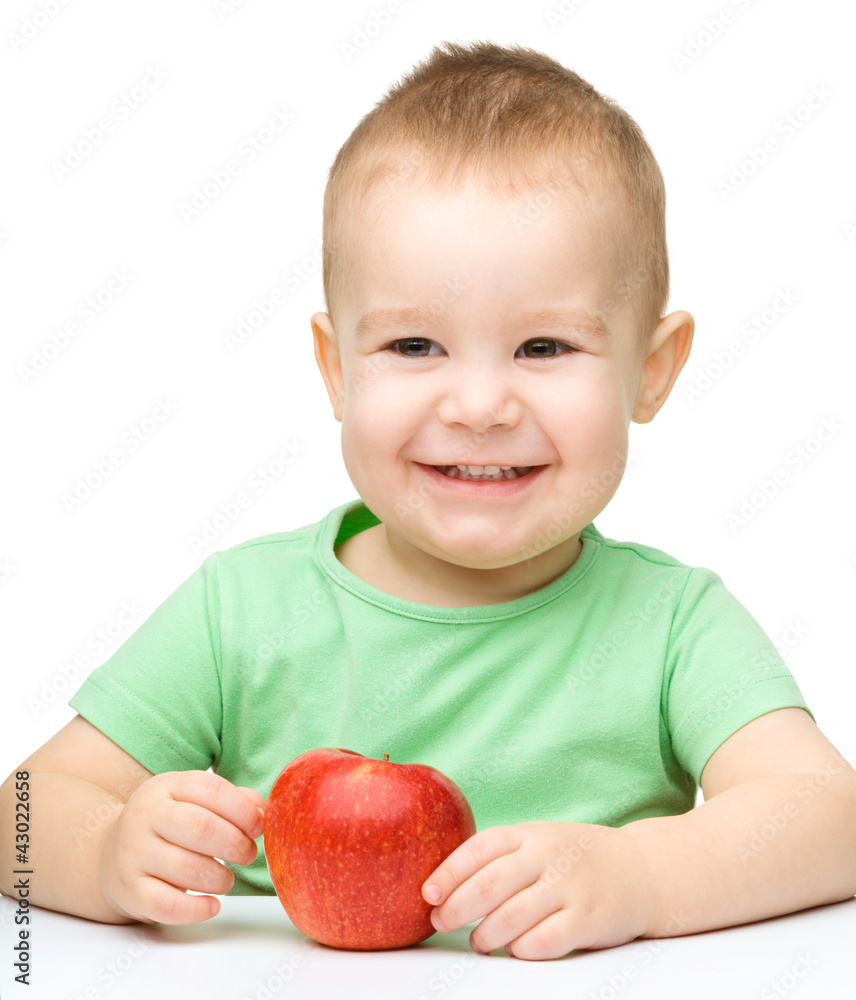 Portrait of a cute cheerful little boy with apple Portrait of a cute cheerful little boy with apple