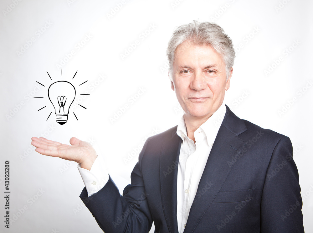 Happy senior businessman with hand gesture showing copyspace on Happy senior businessman with hand gesture showing copyspace on