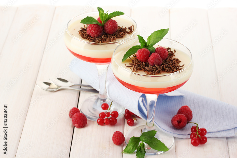 fruit jelly with berries in glasses on wooden table fruit jelly with berries in glasses on wooden table
