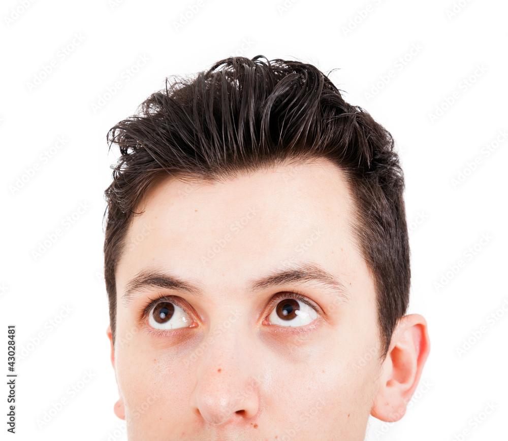 Fototapeta premium Close-up of Young man looking up