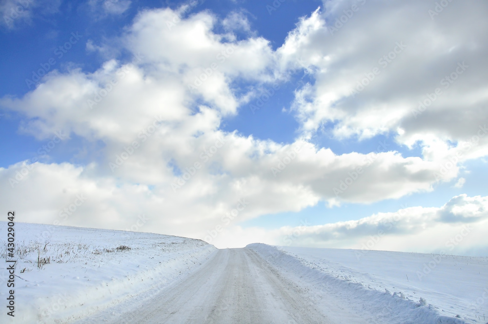 Snow covered country road