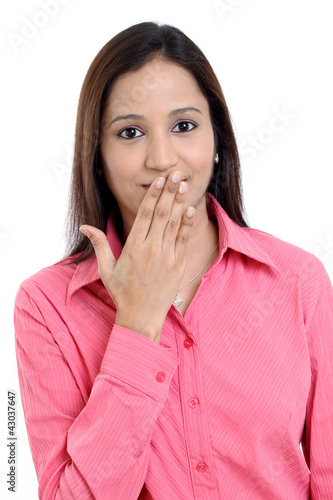 Young woman covering her mouth