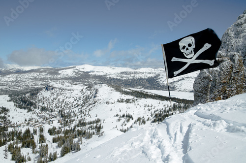 Caution sign at Double Black Diamond ski slopes on ski resort