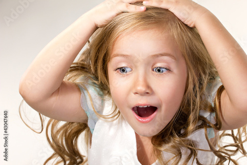 close-up portrait of a little amazing  girl with blue eyes