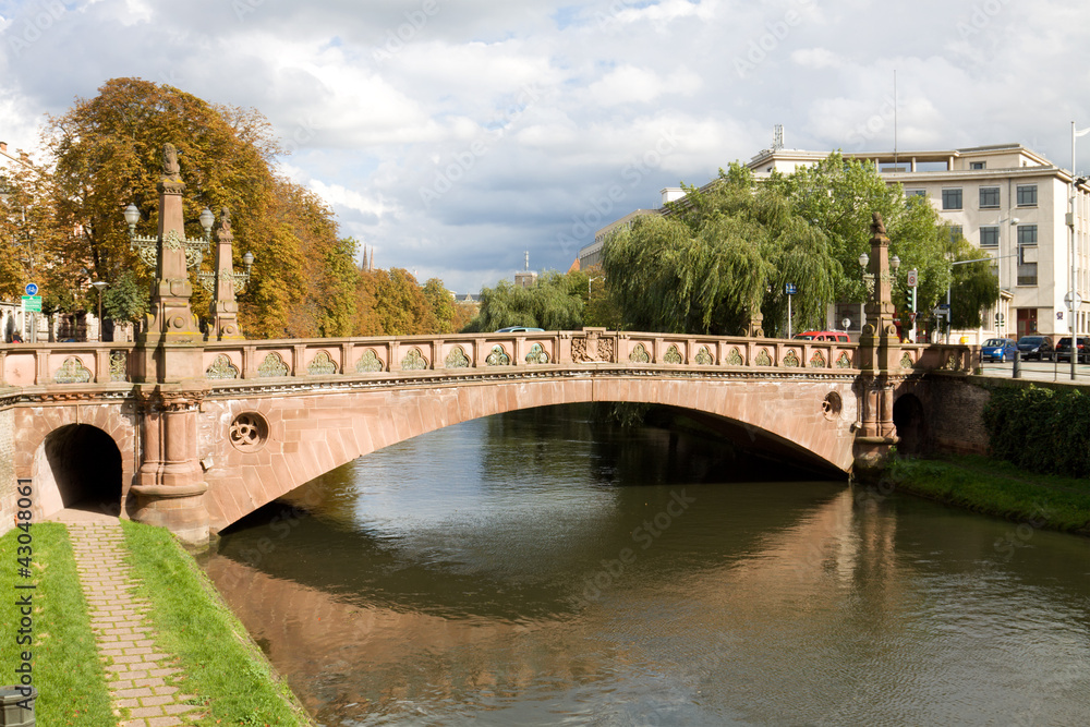 Beautiful cityscape in Strasbourg with a bridge over Ill river Beautiful cityscape in Strasbourg with a bridge over Ill river
