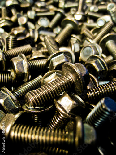 A lot of black steel bolts