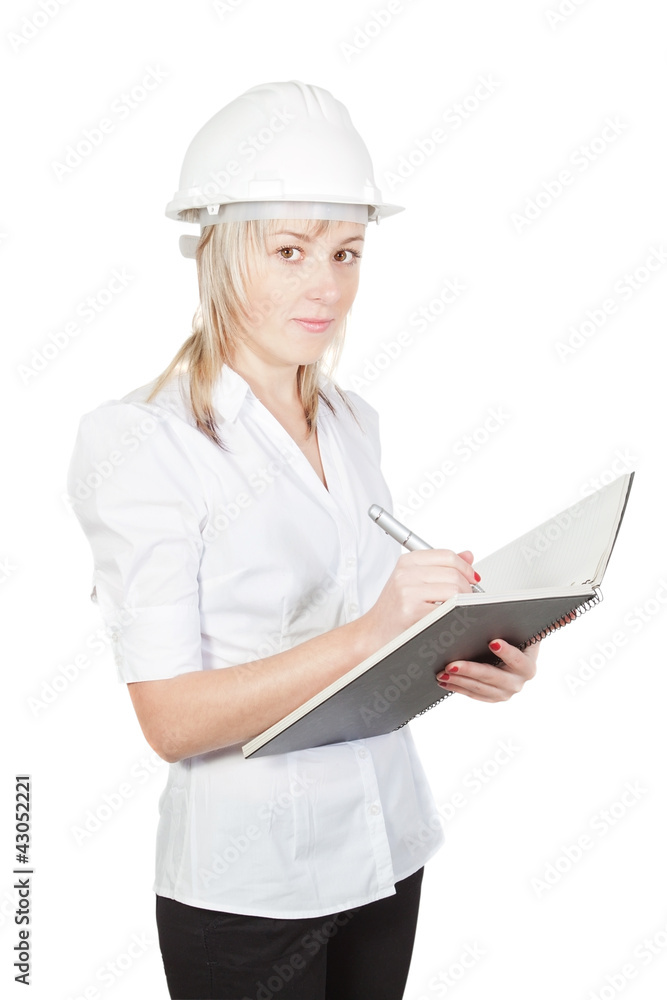 Beautiful girl architect engineer takes notes. On a white backgr Beautiful girl architect engineer takes notes. On a white backgr