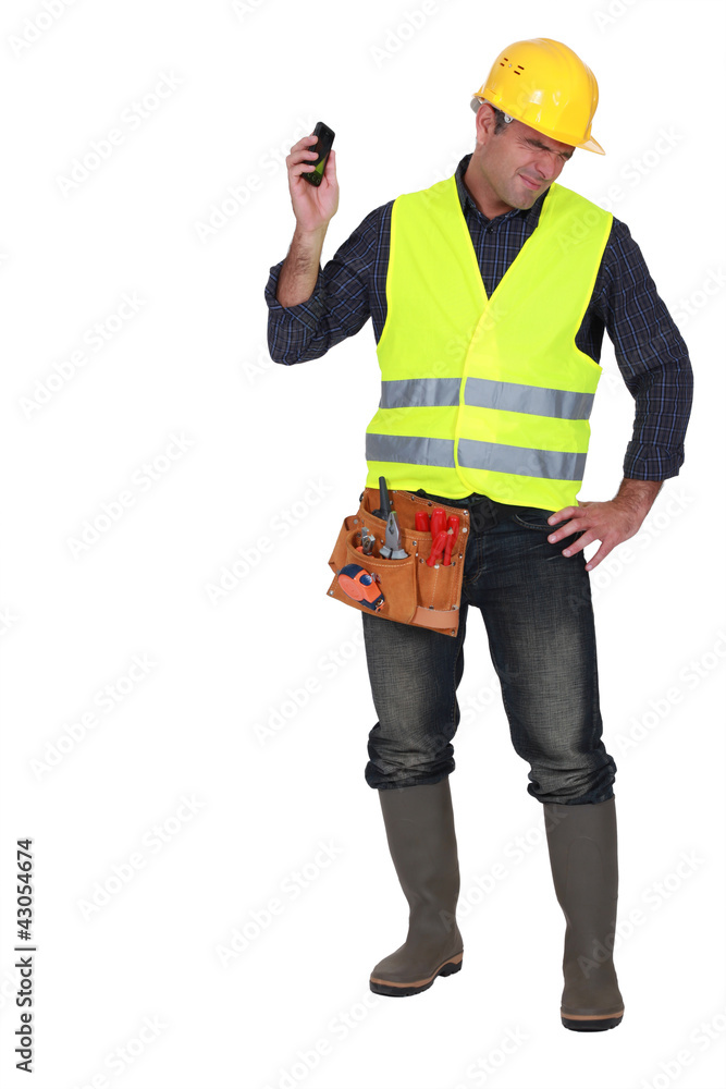 Builder being shouted at over the telephone Builder being shouted at over the telephone