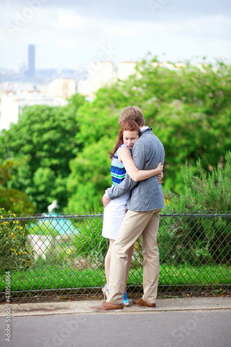 Sensual romantic couple is hugging tenderly in park on Montmartr photo