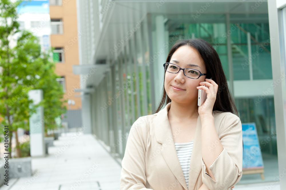 Beautiful young woman using a moblie phone Beautiful young woman using a moblie phone