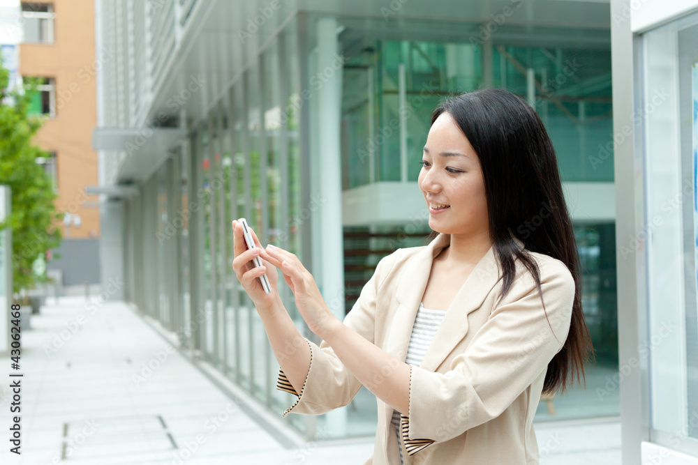 Beautiful young woman using a moblie phone Beautiful young woman using a moblie phone