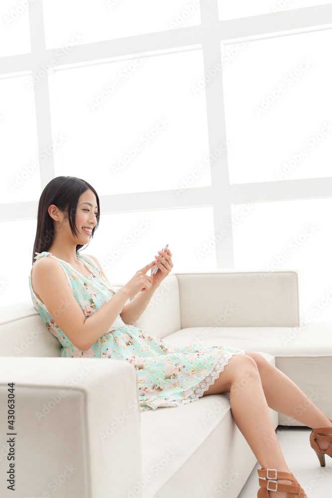 Beautiful young woman using a moblie phone. Portrait of asian Beautiful young woman using a moblie phone. Portrait of asian