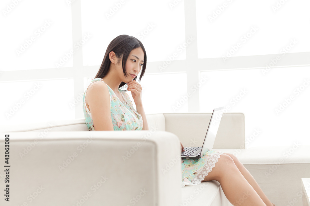 Beautiful young business woman using a laptop. Portrait of asian Beautiful young business woman using a laptop. Portrait of asian