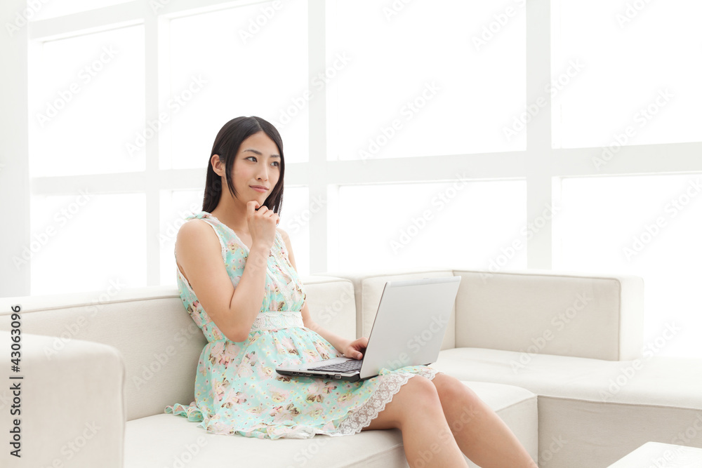 Beautiful young business woman using a laptop. Portrait of asian Beautiful young business woman using a laptop. Portrait of asian