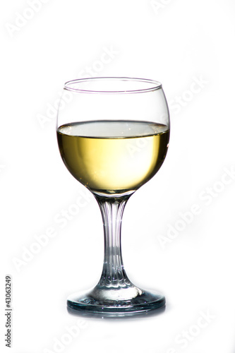Wineglass with cold white wine.
