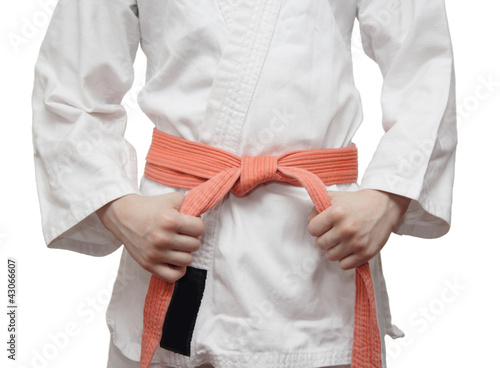 White kimono and an orange belt