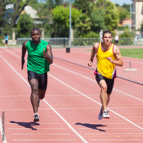 Two Track and Field Athletes Running
