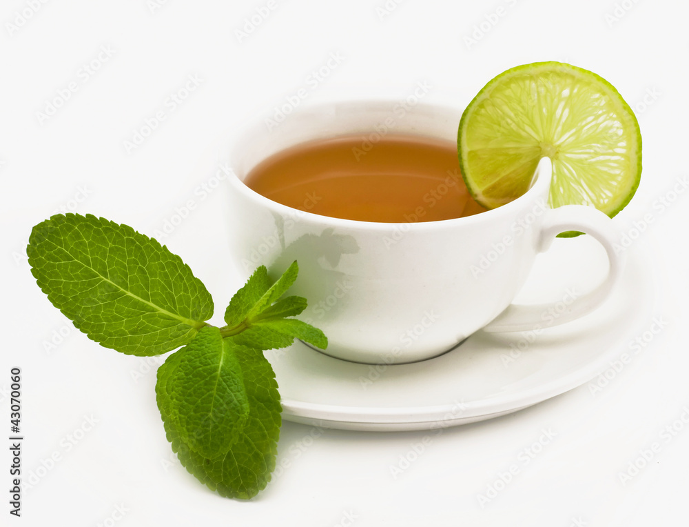 Bright tea in a white cup on a white background