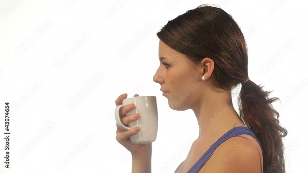 Yong woman drinking tea isolated Yong woman drinking tea isolated