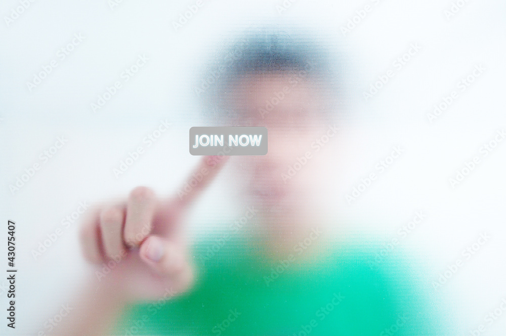 Human finger pressing join now button Human finger pressing join now button