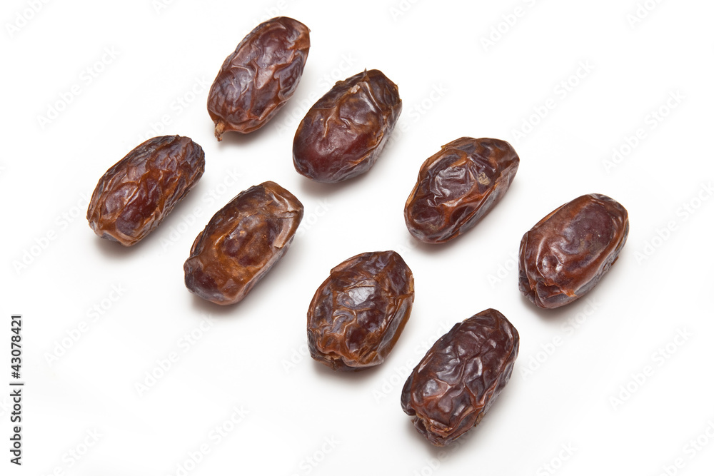 Medjool dates isolated on a white studio background. Medjool dates isolated on a white studio background.