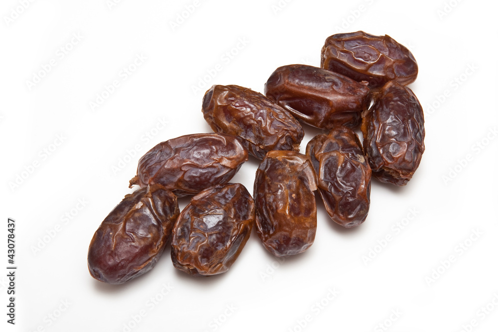 Medjool dates isolated on a white studio background. Medjool dates isolated on a white studio background.